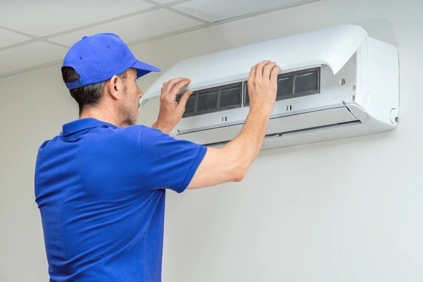 hvac-technician-performing-air-conditioner-600nw-2488702851